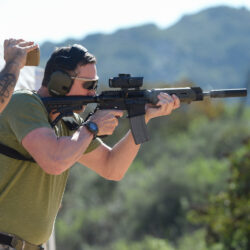 Student practicing rifle handling and marksmanship during structured long gun training on a private outdoor firearms range.
